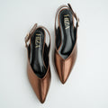 Pair of brown pointed-toe shoes with slingback design on a light gray background